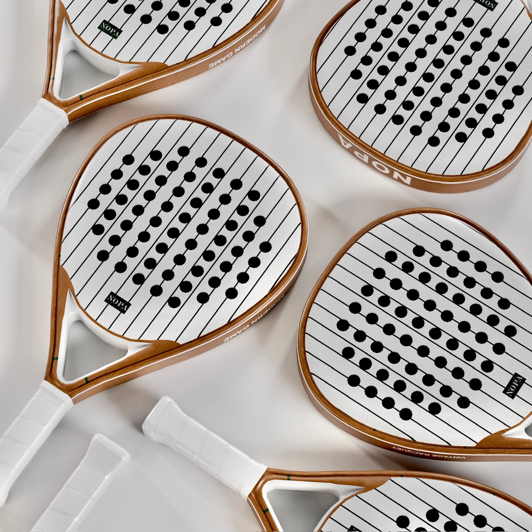 NOPA Vintage Classic padel racquet held in hand at the courts.