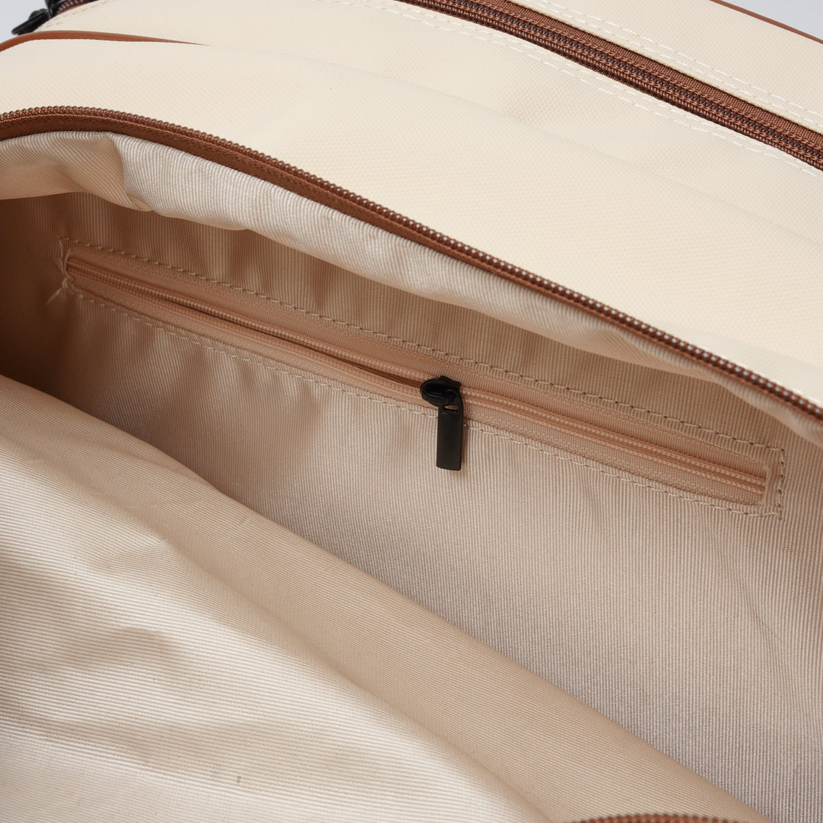 Close-up of the interior zippered pocket inside the NOPA padel racket bag