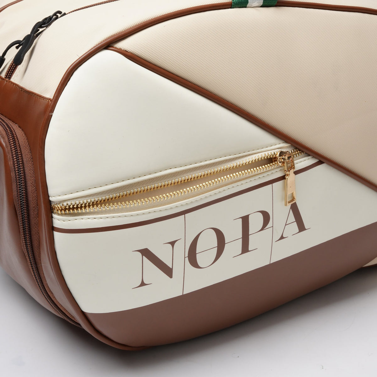 Close-up of the NOPA logo and gold zipper detail on the padel racket bag