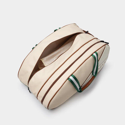 NOPA padel racket bag interior, top view showing the main zippered compartment open