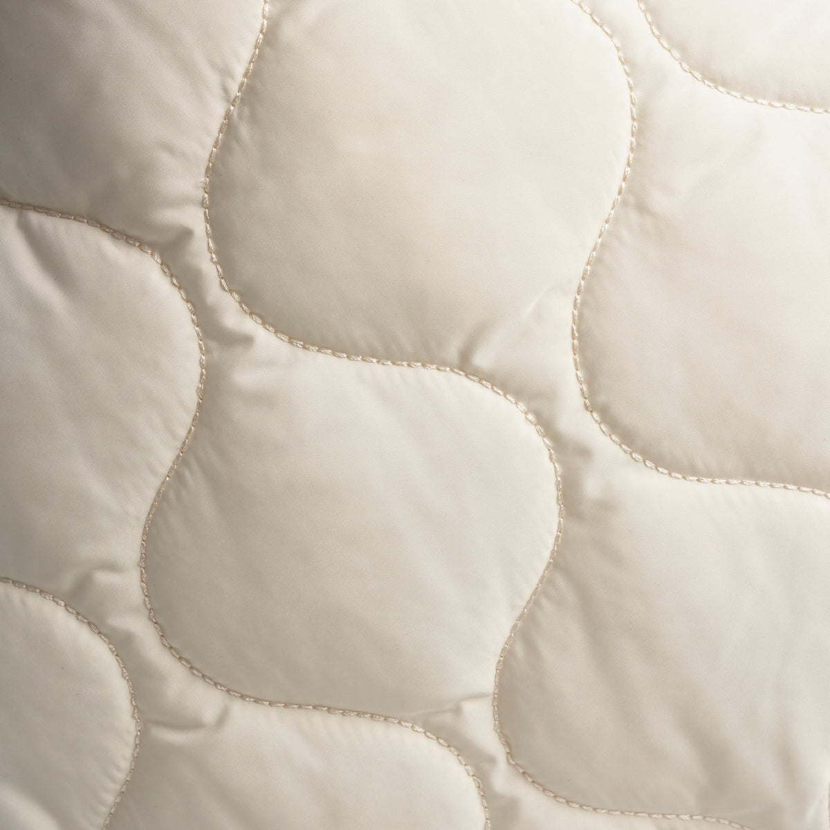 Close-up of the quilted wave-stitch fabric texture on the NOPA padel tote backpack